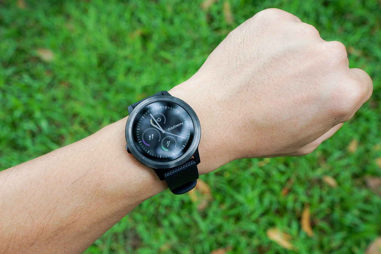 A person's wrist with a smart watch on it.